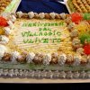 Torta decorata con scritta di arrivederci.